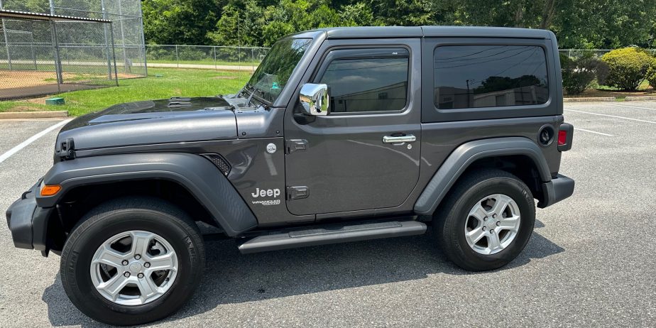 2020 Jeep Wrangler Sport on 14,000 miles. Like new several extras!