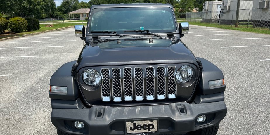 2020 Jeep Wrangler Sport on 14,000 miles. Like new several extras!