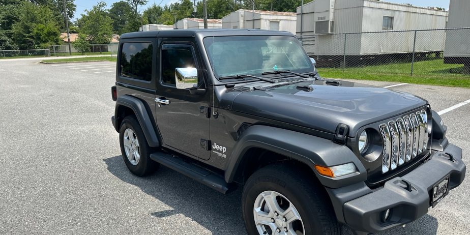 2020 Jeep Wrangler Sport on 14,000 miles. Like new several extras!