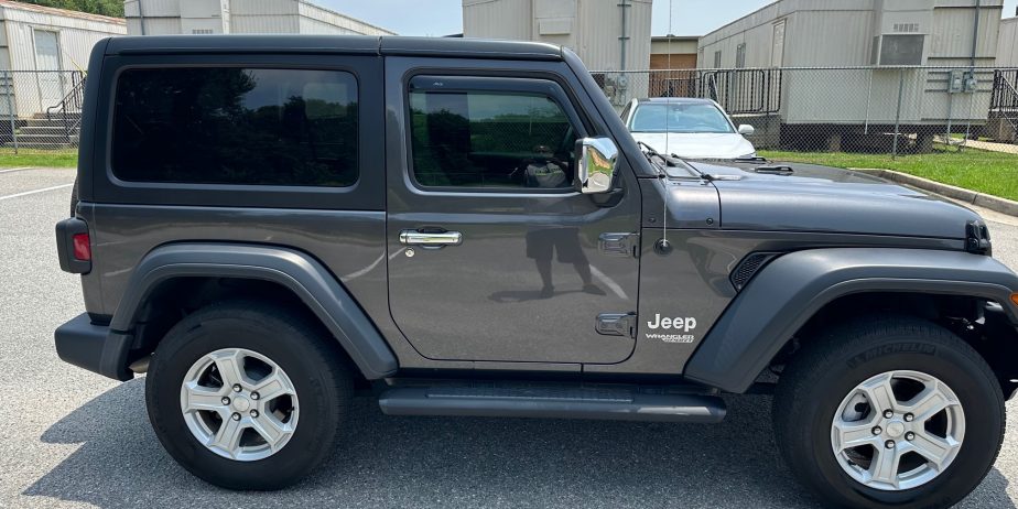 2020 Jeep Wrangler Sport on 14,000 miles. Like new several extras!