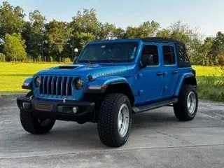 Mytop push button convertible 6.4/392 V8 w 475 HP 0-60 in 4.2 seconds Banks pedal monster Additional 1.5” lift, 4:56 gearing, Matching blue hardtop Method 315 rims 35x20x12:50 Rear view camera/mirror w recording.