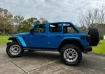 Mytop push button convertible 6.4/392 V8 w 475 HP 0-60 in 4.2 seconds Banks pedal monster Additional 1.5” lift, 4:56 gearing, Matching blue hardtop Method 315 rims 35x20x12:50 Rear view camera/mirror w recording.