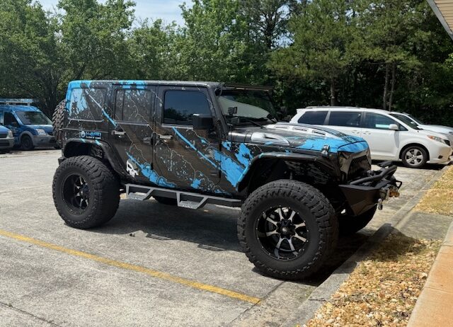 This 1 of a kind Jeep is custom from front to rear, top to bottom