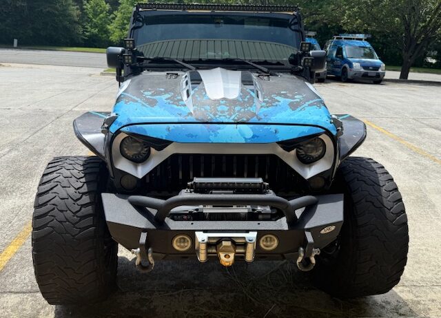 This 1 of a kind Jeep is custom from front to rear, top to bottom