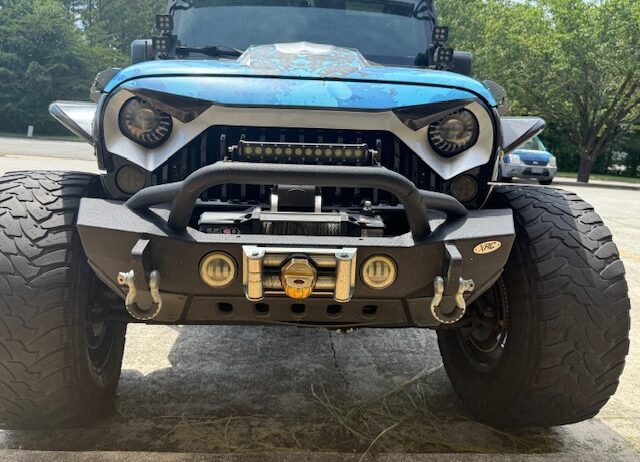 This 1 of a kind Jeep is custom from front to rear, top to bottom