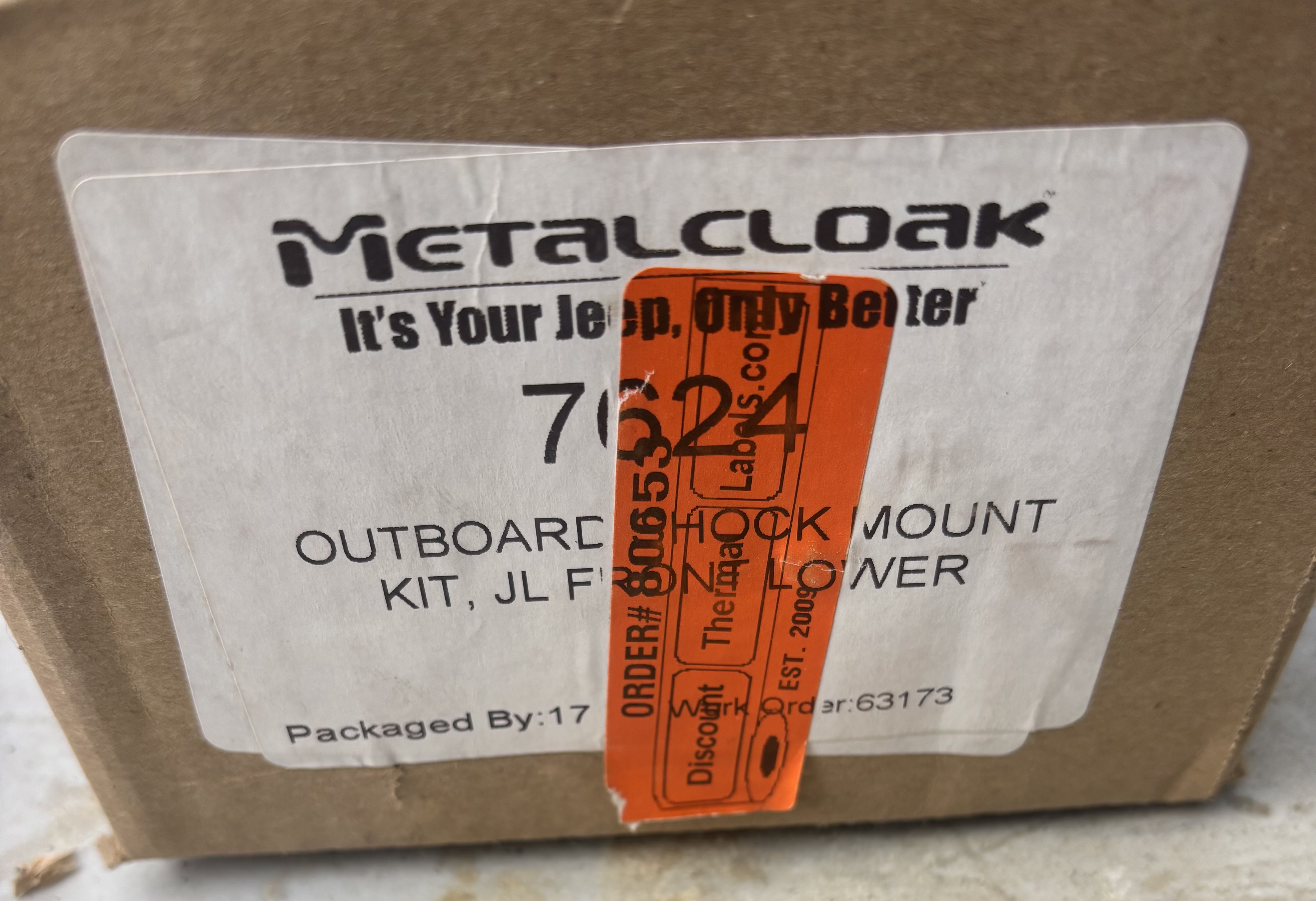 Outboard shock mount spacer relocation kit