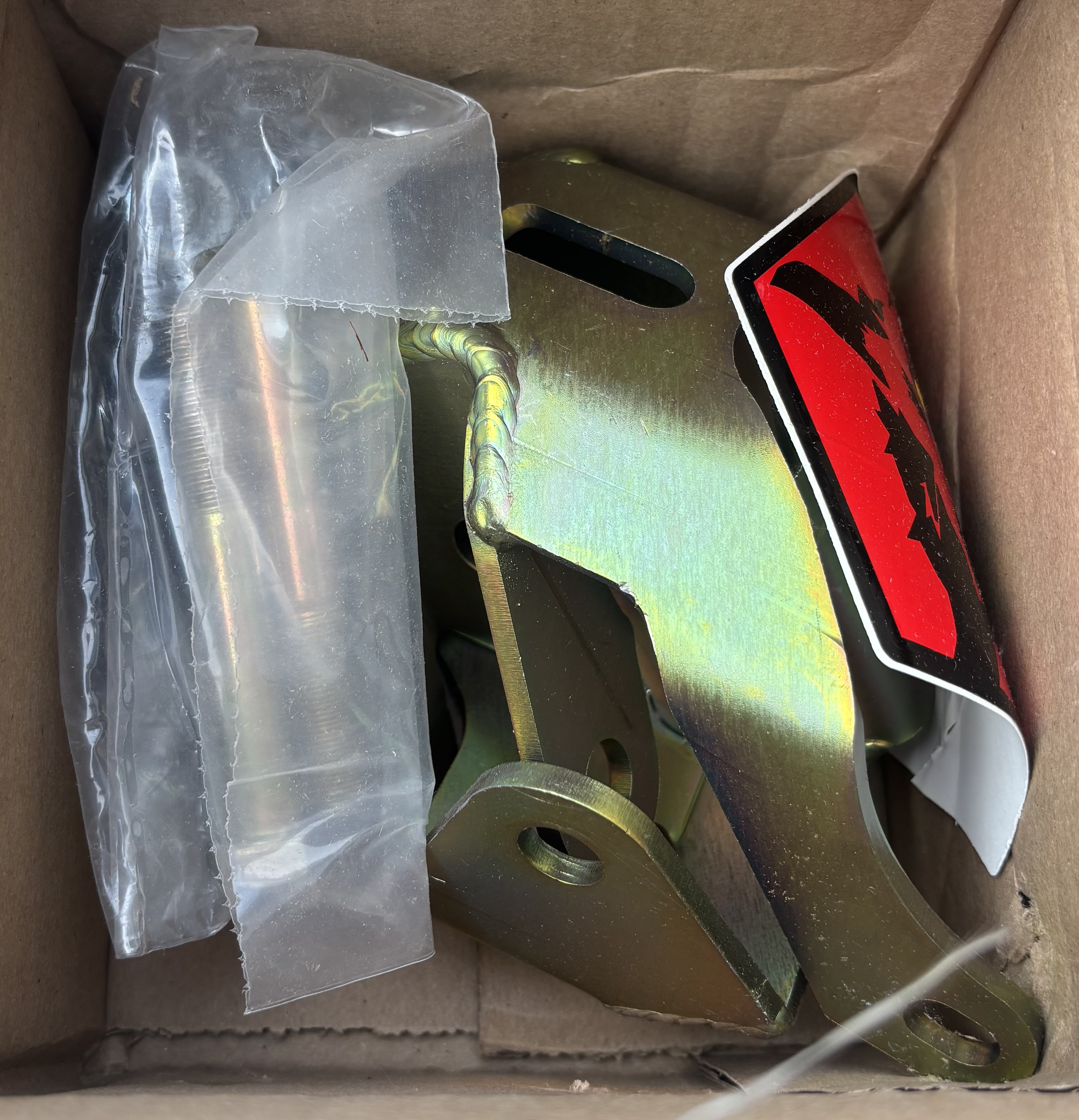 Outboard shock mount spacer relocation kit